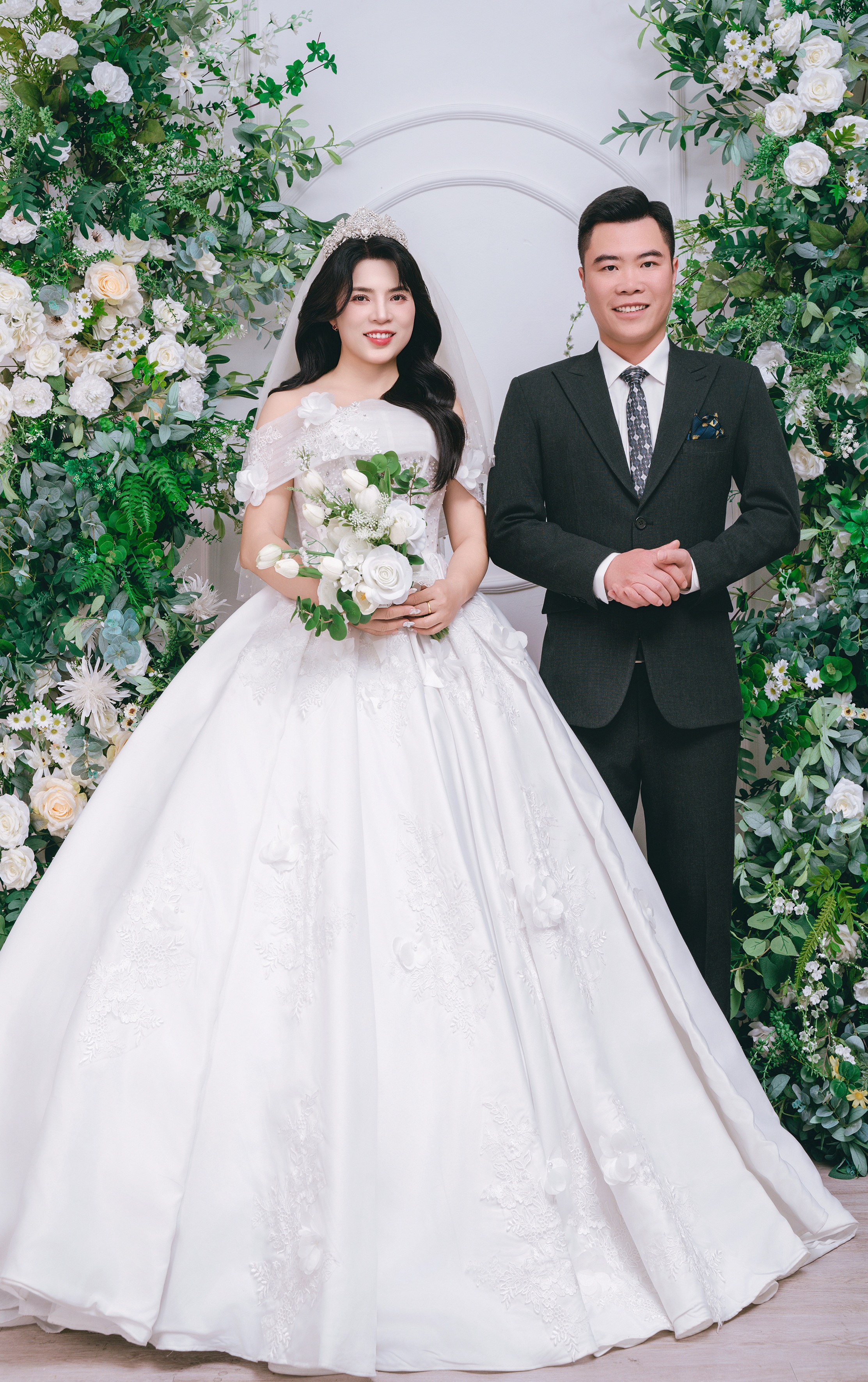 A bright pink sheet of paper used to wrap flowers curves in front of rich blue background